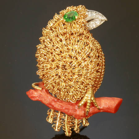 Fifties golden bird with demantoid eye and diamond beak on coral branch