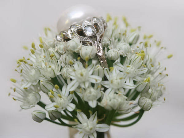 White gold estate engagement ring with impressive pearl and diamonds
