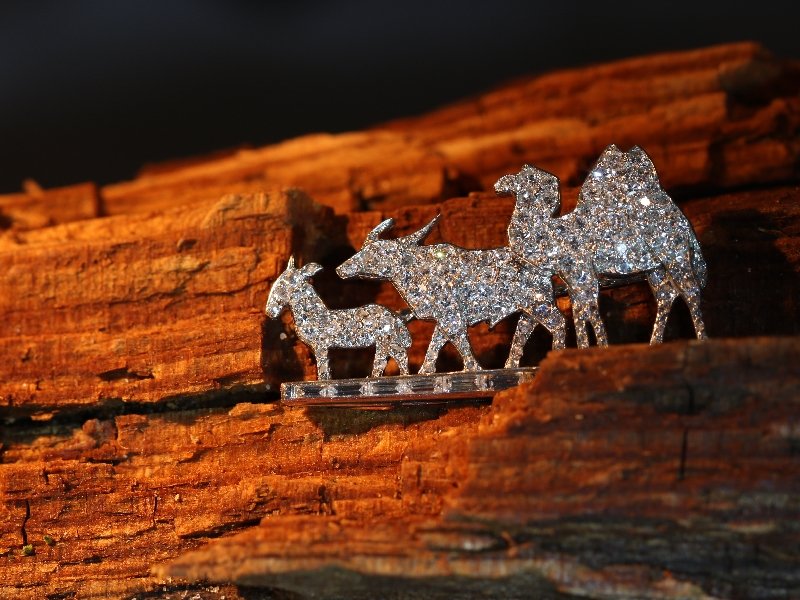 Click the picture to get to see this Fairylike Cartier Paris Art Deco diamond brooch with donkey/mule, buffalo and camel.