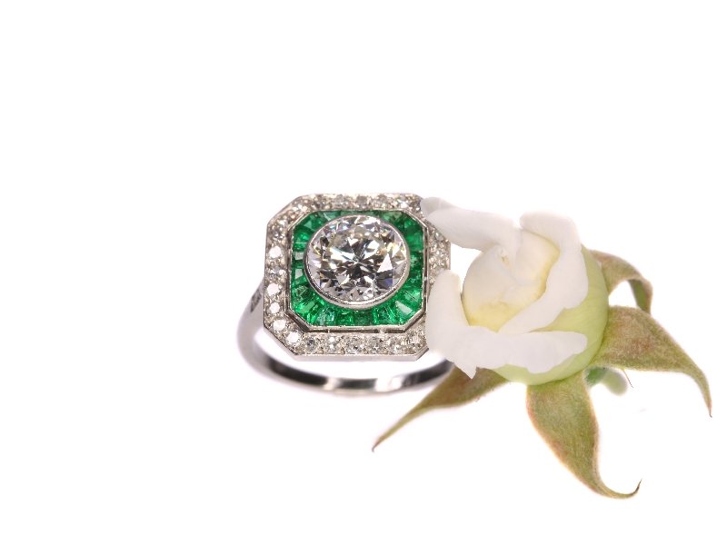Click the picture to get to see this Art Deco platinum engagement ring with 1.55 ct white diamond and Brazilian emeralds.