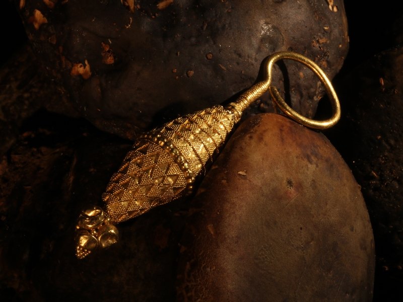 Click the picture to get to see this Ancient yellow gold granulated ear-ring.