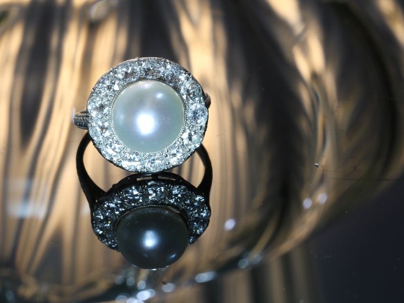 Click the picture to get to see this diamond and pearl platinum estate engagement ring.