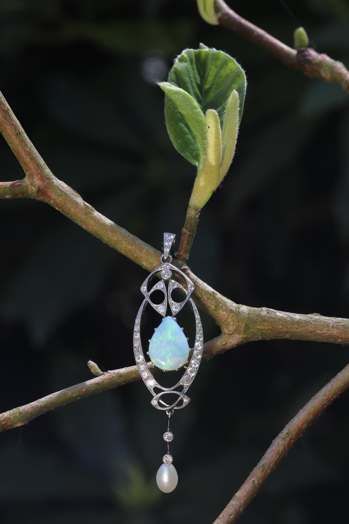 Click the picture to get to see this Vintage platinum Art Nouveau pendant with diamonds and large opal.