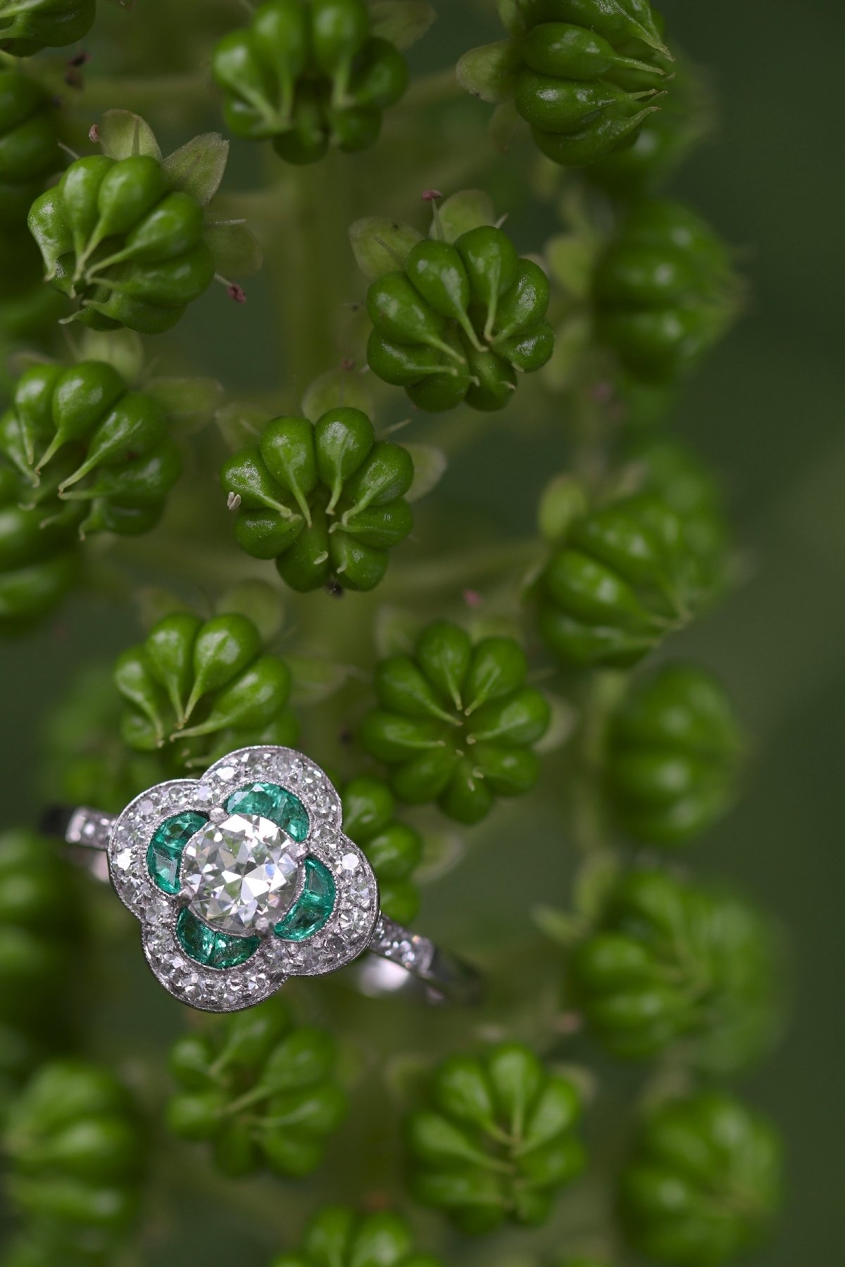 Click the picture to get to see this Art Deco diamond and emerald engagement ring.